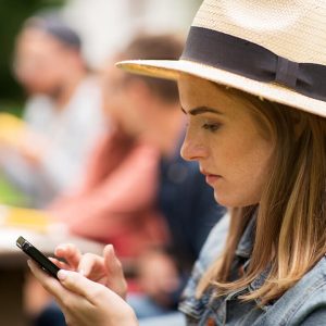 leisure-holidays-people-technology-concept-close-up-young-woman-teenage-girl-texting-smartphone-friends-having-dinner-summer-garden-party (1)